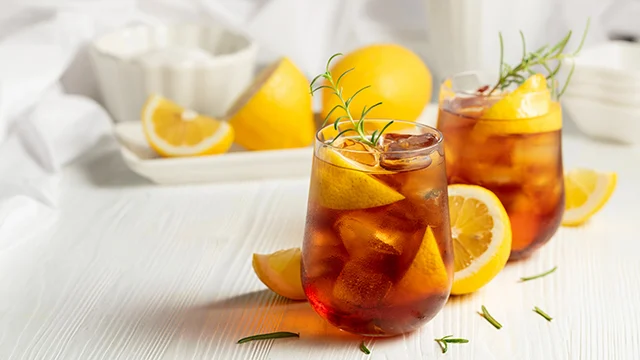 Iced tea or alcoholic cocktail on a white table