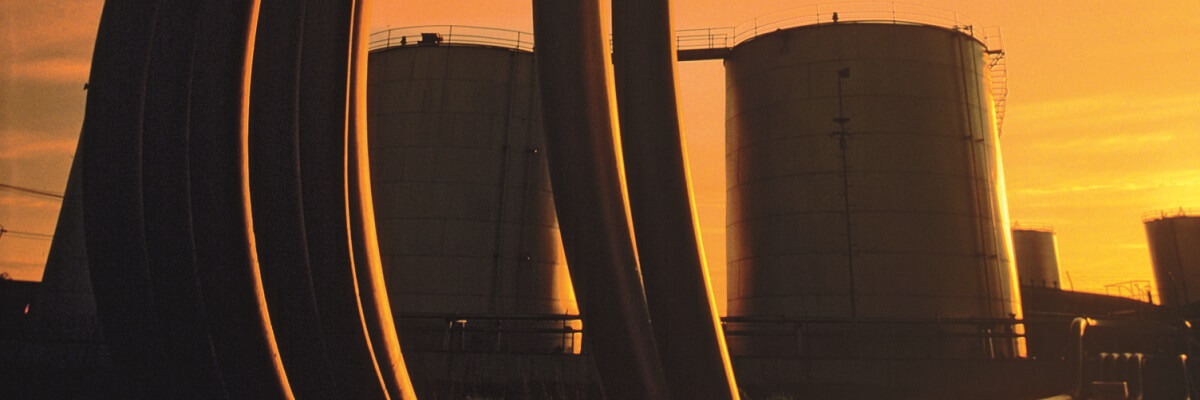crude oil refinery tower at dawn