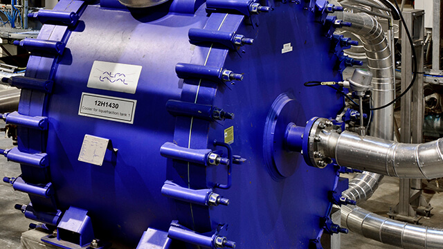 Closeup of a blue Alfa Laval welded spiral heat exchanger